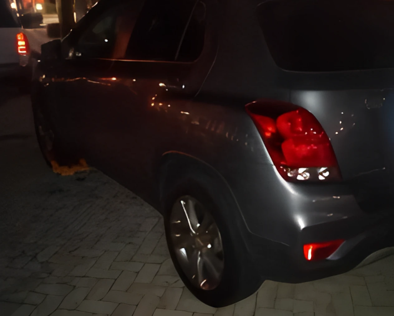 Dark SUV with brake light on