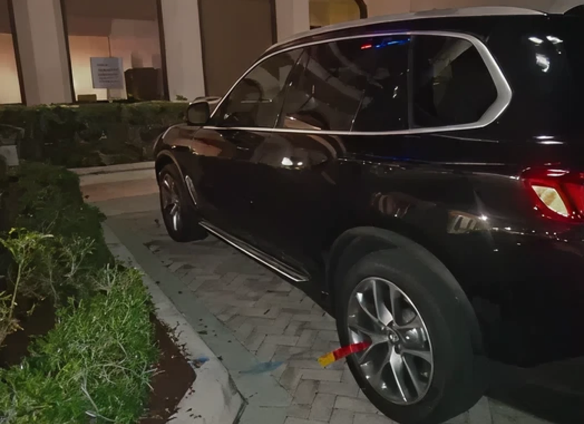 Black SUV parked on curb
